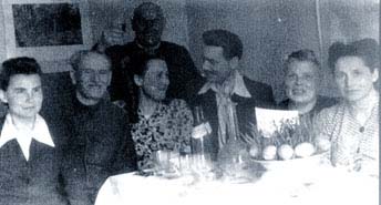 Easter 1955 in exile in Yenisseysk. Kazimesh Slobodzyanek (standing). At the table (from left to  right): Isabela Jasinska (pseudo Marianna Mikolay Schiller, Galina Vlad (Lemberg) and Stanislav Vlad, Pani Lemberg (Galinas mother) and Barbara Olendzka.